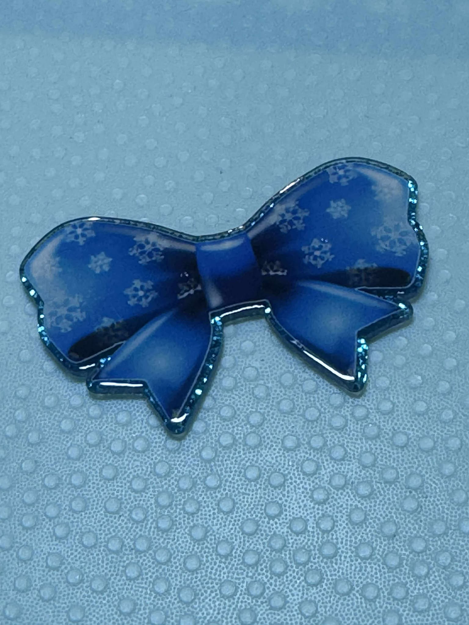 Blue bow with snowflakes acrylic piece, for badges, pens, earrings etc