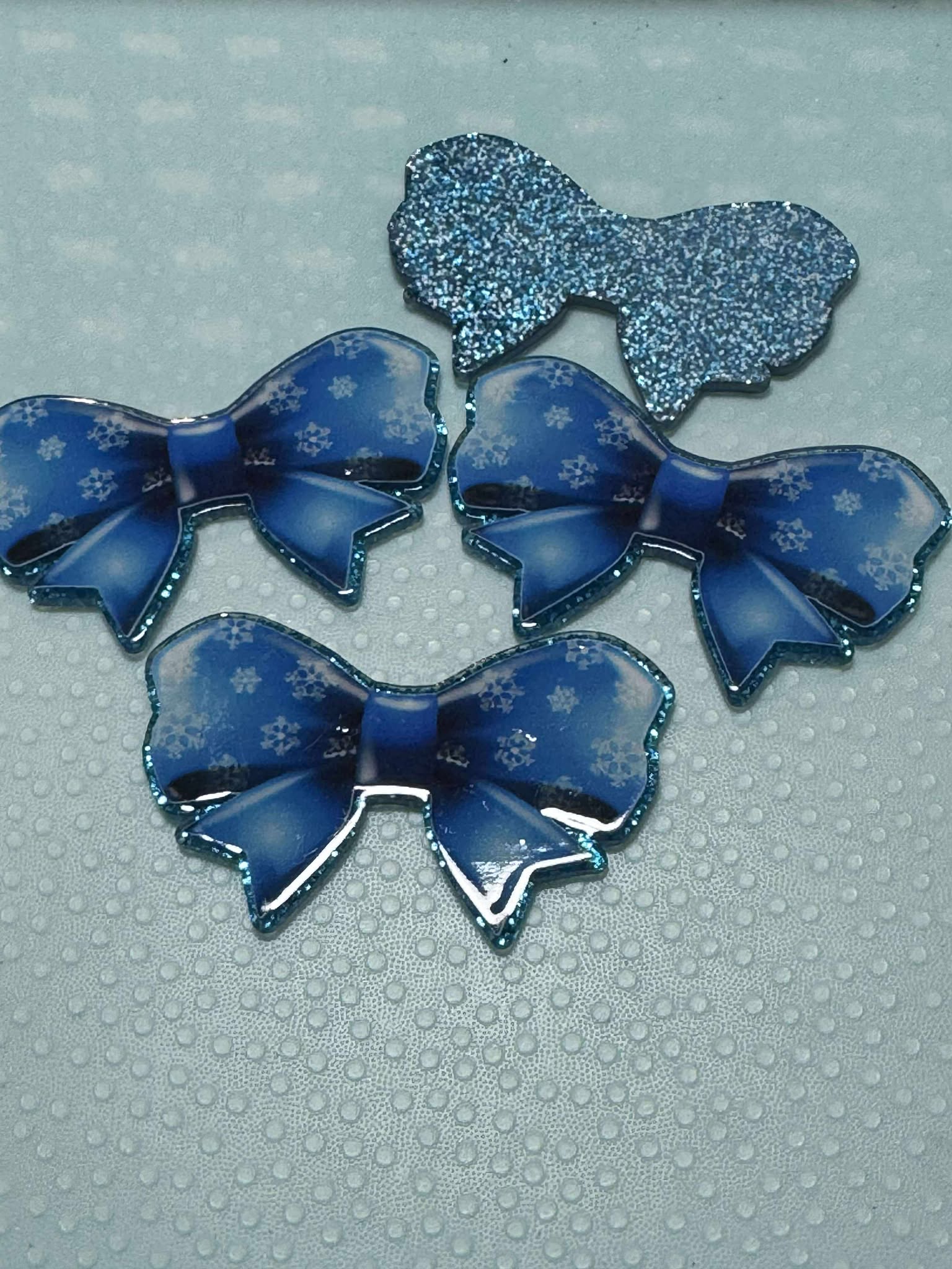 Blue bow with snowflakes acrylic piece, for badges, pens, earrings etc