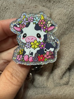 Cow with black spots, badge reel with retractable badge clip