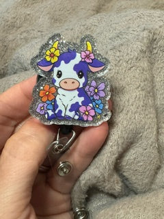 Cow with purple spots, badge reel with retractable badge clip